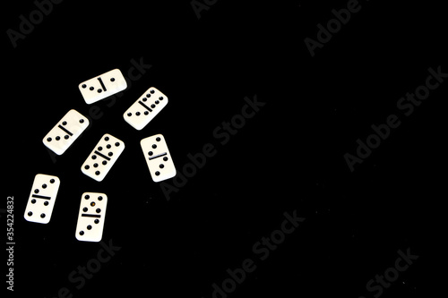 Dominoes on a black background.