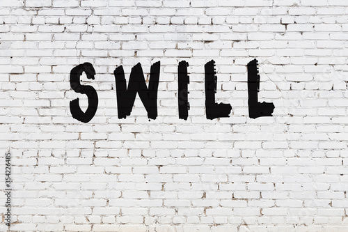 Photography Word swill painted on white brick wall