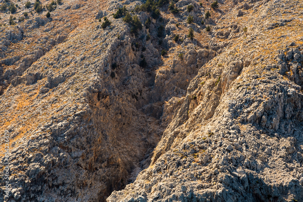 Rock formation showing layers of textured sedimentary rock Rock formation showing layers of textured sedimentary rock