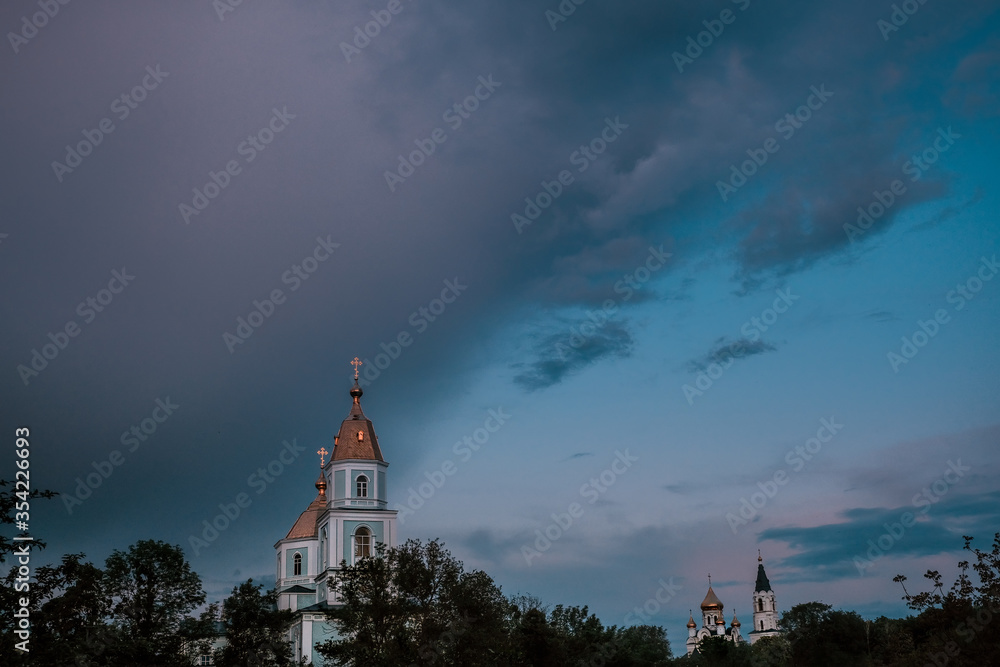 Night city church on light background. Old town. Scenic cityscape.