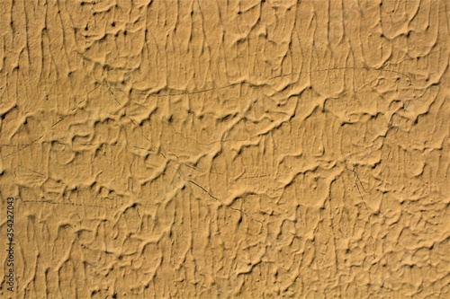 evocative image of yellow painted wall texture