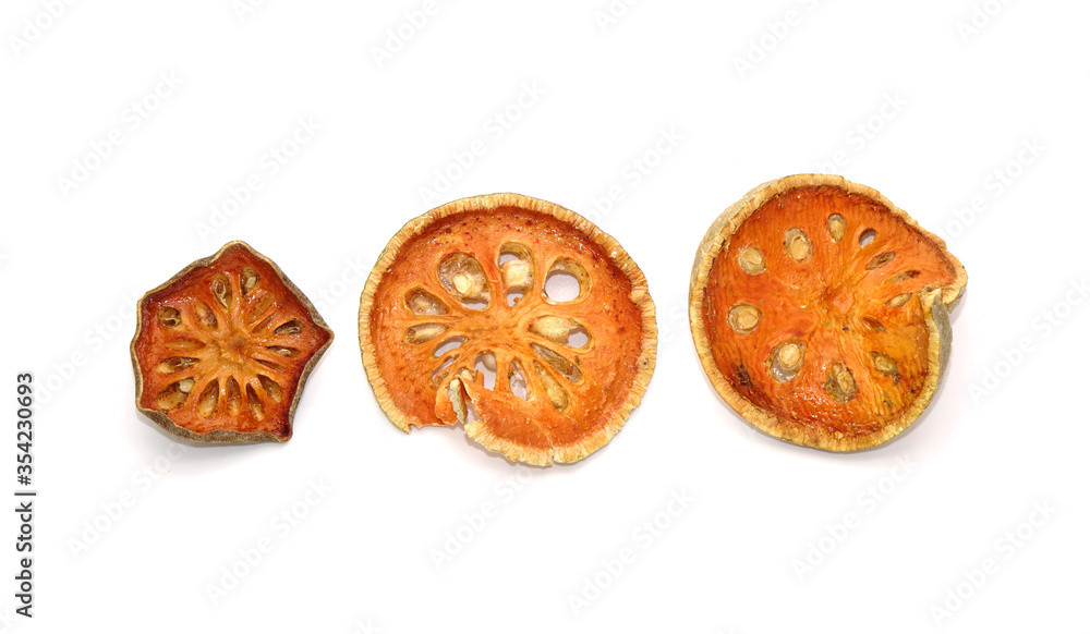Dried sliced Bael fruit isolated on white background. Bael fruit has
