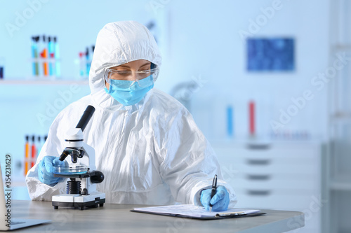 Scientist working with micr...