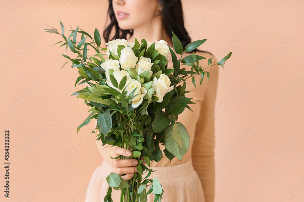 Beautiful young woman with bouquet of roses on color background Beautiful young woman with bouquet of roses on color background