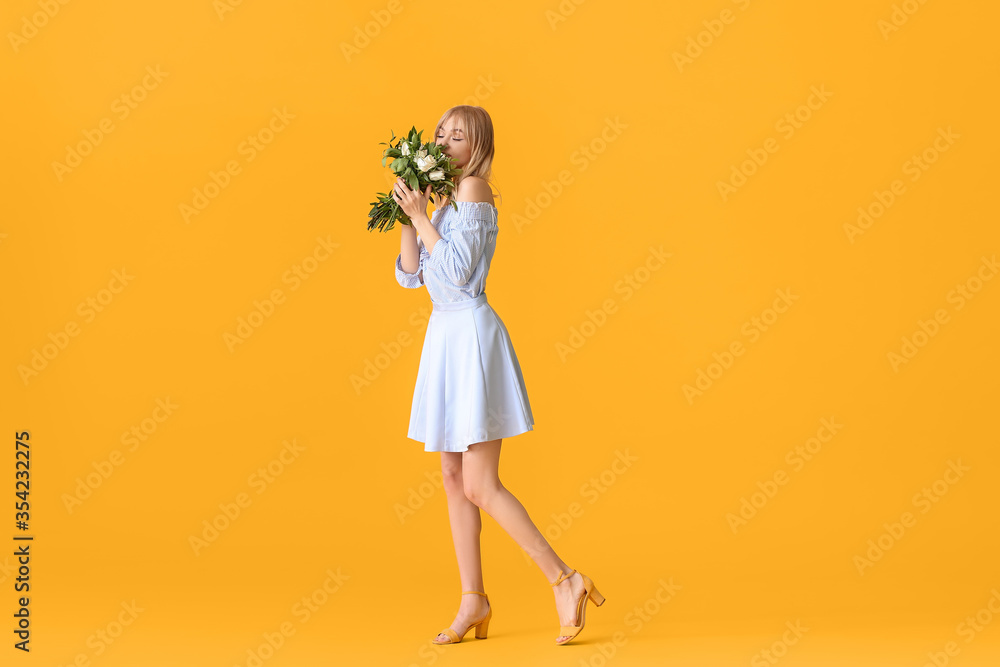 Beautiful young woman with bouquet of roses on color background Beautiful young woman with bouquet of roses on color background
