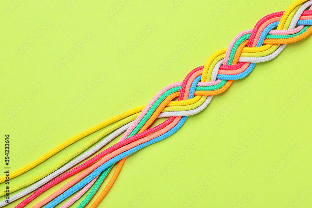 Braided ropes on color background. Unity concept Braided ropes on color background. Unity concept