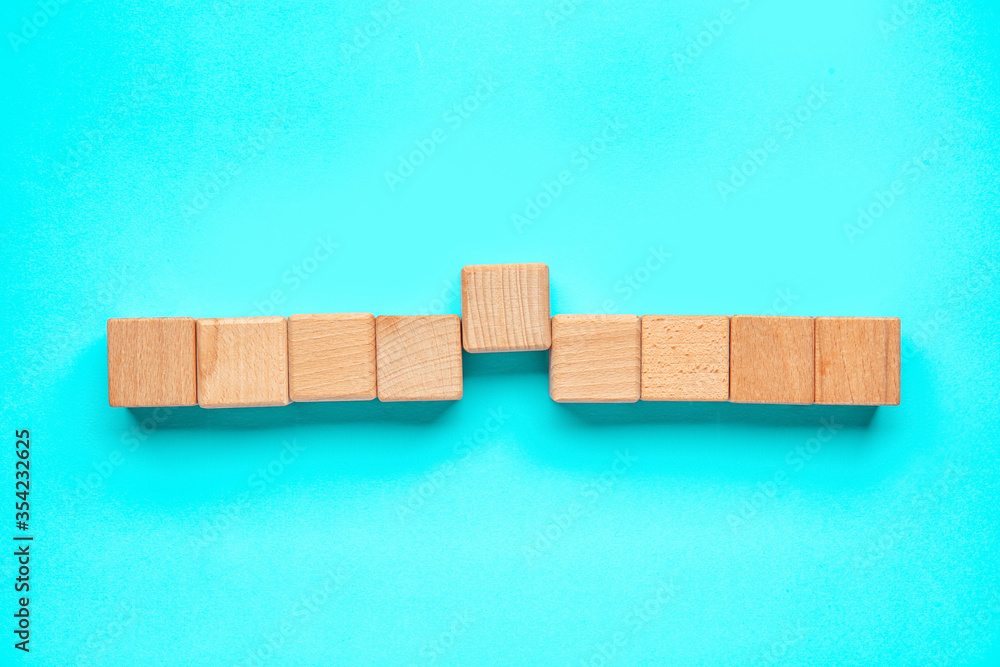 Wooden cubes on color background. Unity concept Wooden cubes on color background. Unity concept