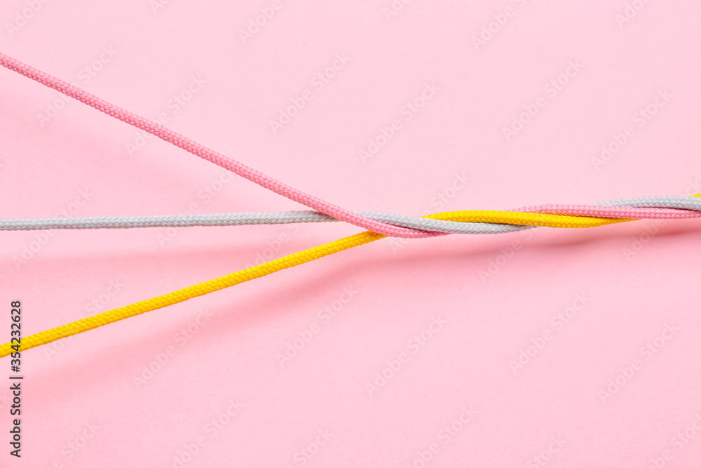 Twisted ropes on color background. Unity concept Twisted ropes on color background. Unity concept
