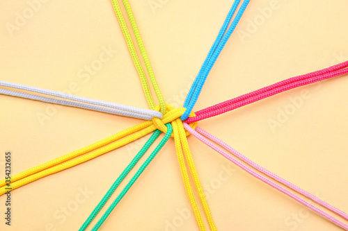 Tied ropes on color backgro...