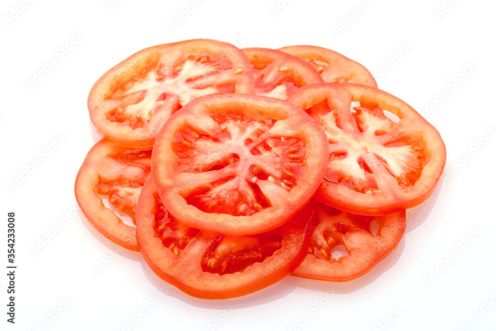 Tomato slices isolated on white background. Tomato slices isolated on white background.