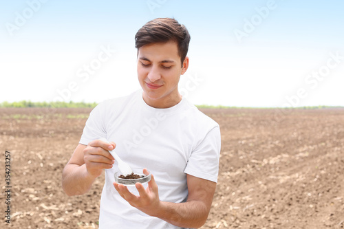 Agronomist with sample of s...