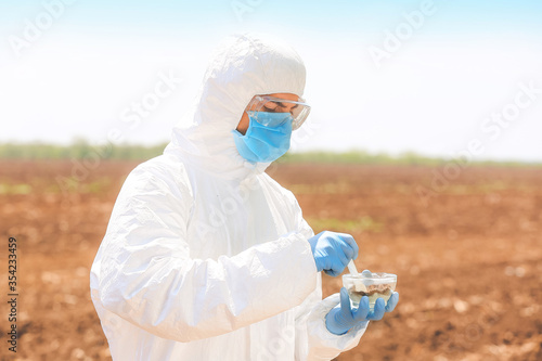 Scientist studying samples ...
