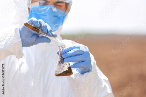 Scientist studying samples ...
