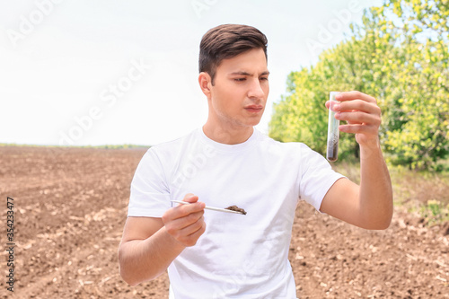 Agronomist studying sample ...