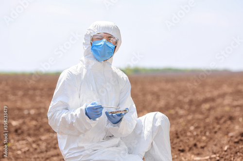 Scientist studying samples ...