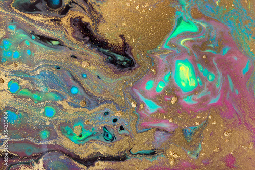 Dark and gold liquid pattern with bright green cells.