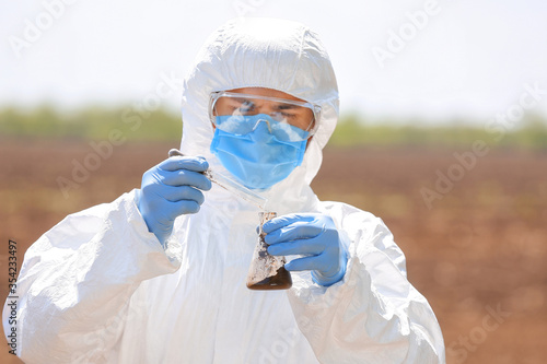 Scientist studying samples ...