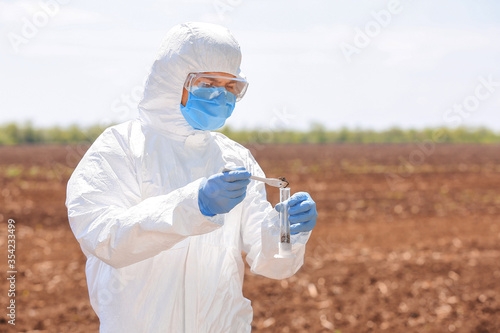 Scientist studying samples ...