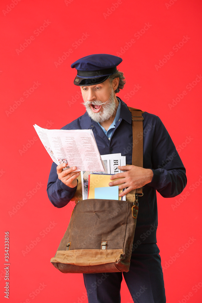 Surprised old postman on color background Surprised old postman on color background