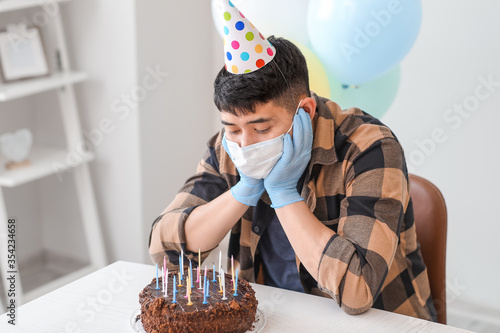 Sad Asian man celebrating B...