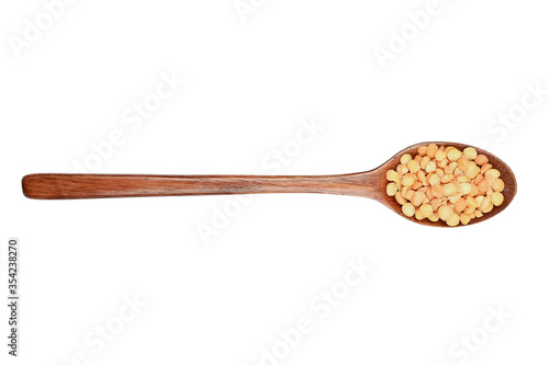 Wooden spoon and peas on an isolated background