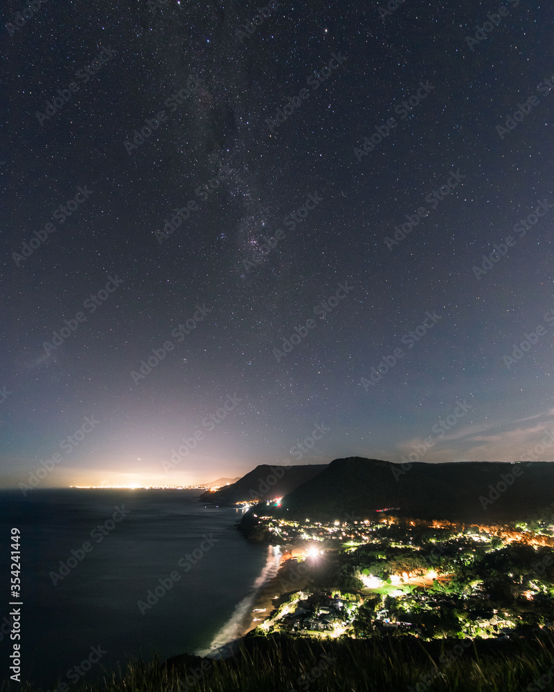 Night view from Bald Hill lookout with starry sky.
