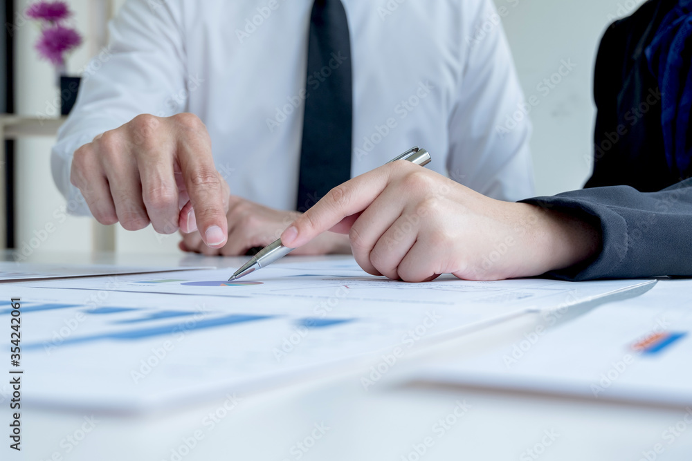 Two business leader discussing the charts and graphs showing the results, Planning to start new strategy for big success In the office