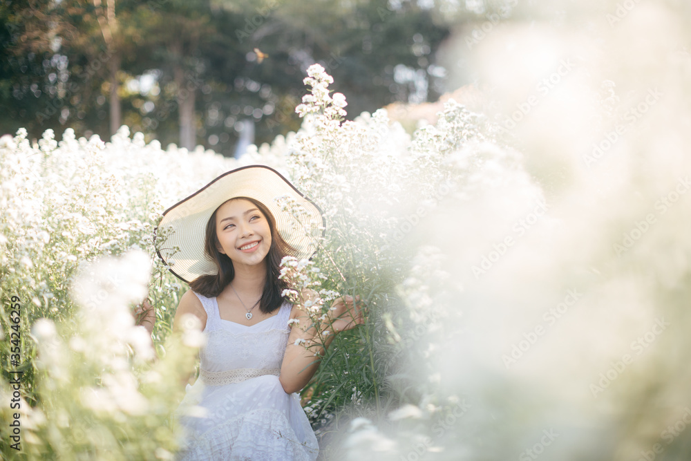 outdoor portrait of a beautiful asia woman. attractive cute girl in a field with flowers outdoor portrait of a beautiful asia woman. attractive cute girl in a field with flowers