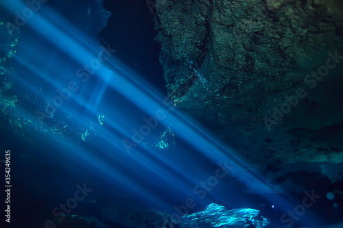 underwater landscape mexico, cenotes diving rays of light under water, cave diving background © kichigin19