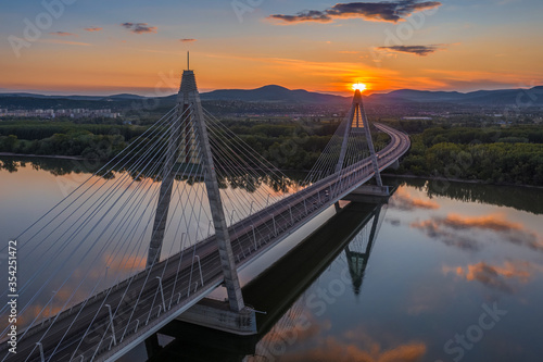 Photography Budapest, Hungary - Aerial view of Megyeri suspension bridge at sunset with beau