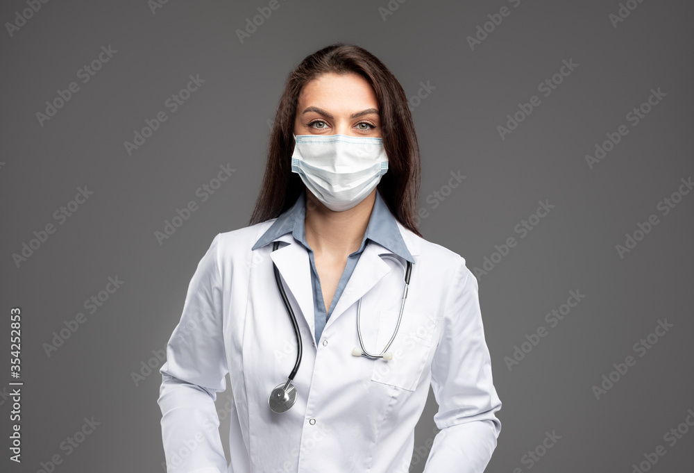 Confident female doctor in medical mask