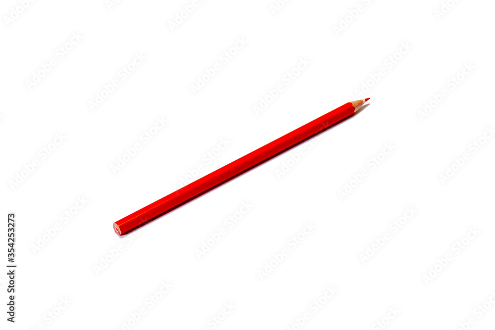 Red pencil lies diagonally on a white background. Isolate Red pencil lies diagonally on a white background. Isolate