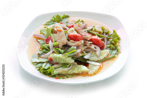 Grilled Pork Neck Salad Thai food served. Hot and Spicy Slice grilled pork menu Asian food isolated on white background. With clipping path.