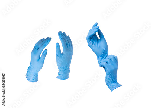 Set of isolated blue nitrile or latex gloves isolated on white background