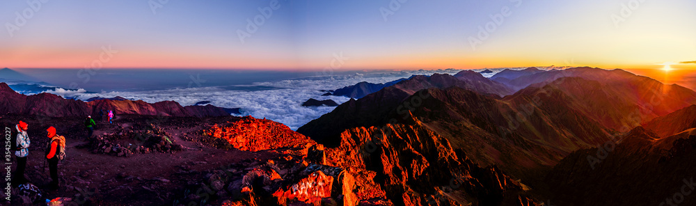 On the summit of Jebel Toubkal, highest mountain in Morocco during sunrise.