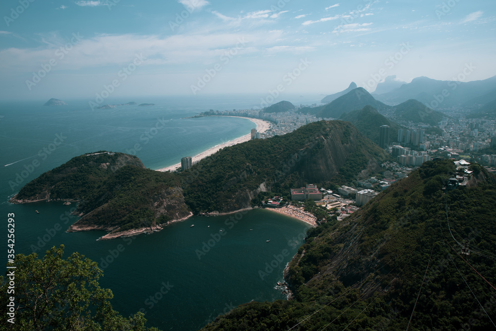 View of the Sugar Loaf in Botafogo, a mountain, and a landscape of Rio de Janeiro from a cable car, Brazil. 