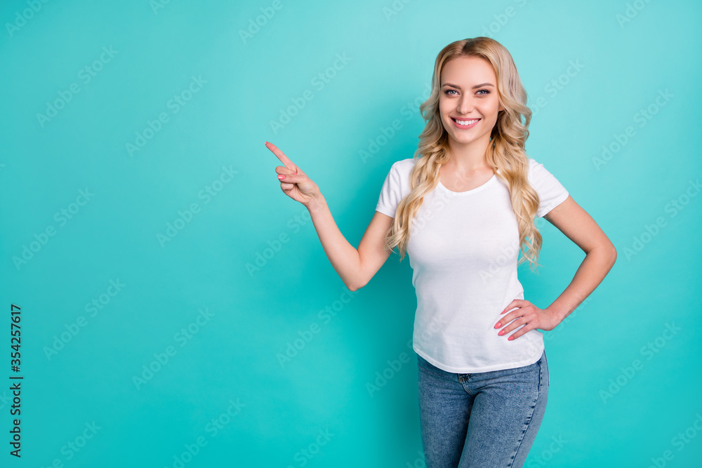 Fototapeta premium Portrait of positive confident cool woman promoter point index finger copyspace indicate ads promotion recommend suggest select wear good look clothes isolated teal color background
