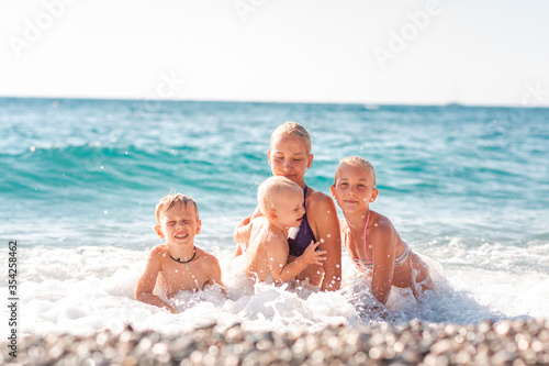 Happy kids on the beach having fun