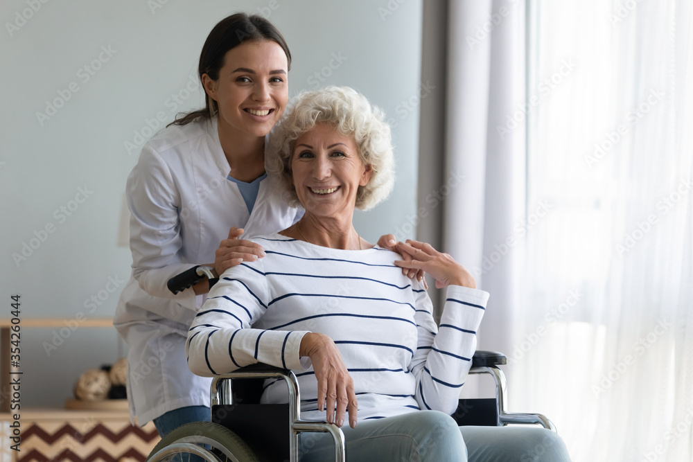 In living room handicapped injured woman sitting in wheel chair