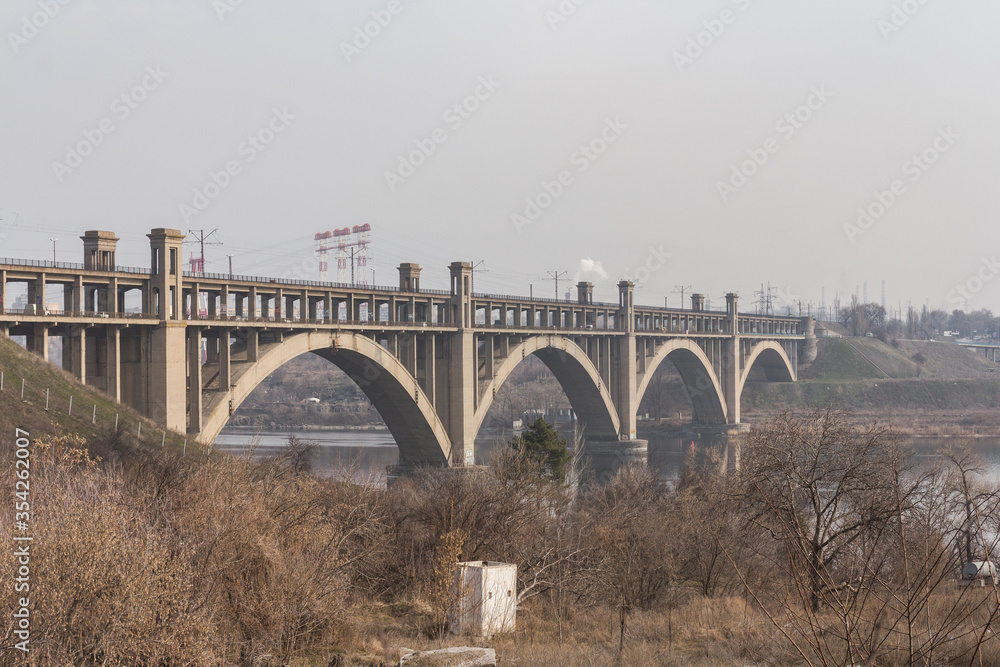 Fototapeta premium View of the Preobragensky Bridge in Zaporizhzhia in the morning. Ukraine