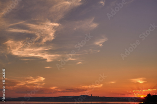 A sunset over a body of water