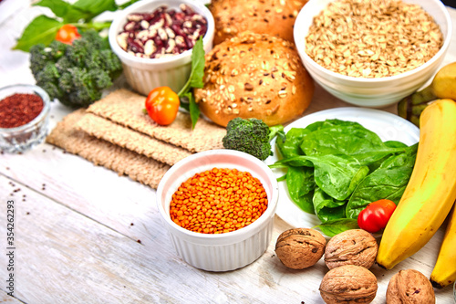 High Fiber Foods on white wooden background, Healthy balanced dieting concept. Top view, flat lay, copy space.