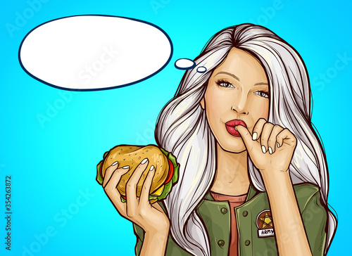 Vector pop art girl in green military-colored jacket with burger licking her finger, isolated on blue background. Pretty young woman holding in hand tasty huge hamburger. Fast food advertising concept