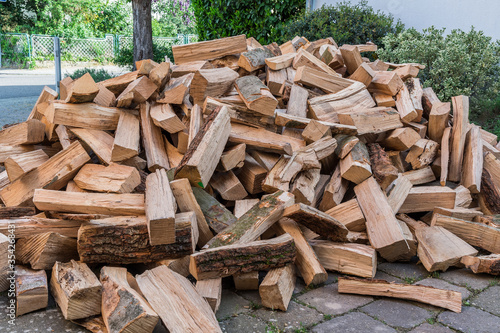 Messy pile of firewood on a drive, delivered for the winter stock Fototapeta