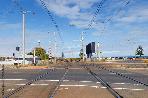 The level crossing over the main road at Brighton Beach Railway Station which is located on the Sandringham line in Victoria, Australia.