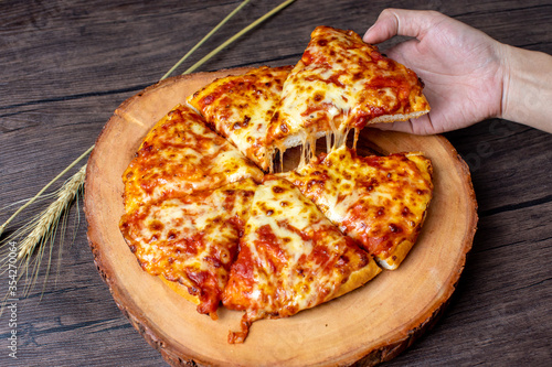 pizza on a wooden plate