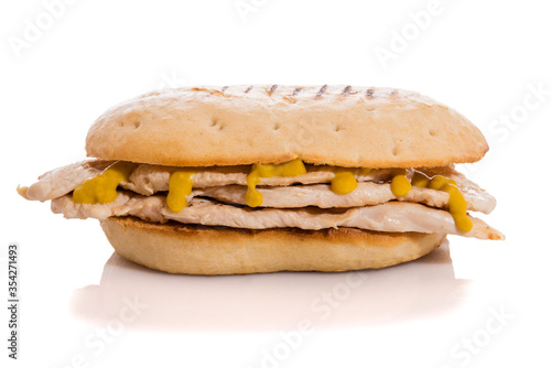 Chicken sandwich with mustard isolated on white.