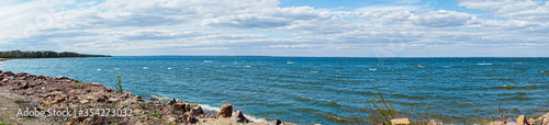 Panorama of Kyiv sea with clouds on horizon, windy sunny day