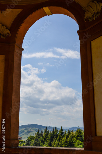 The hills around Bologna as seen through an arch of the  Madonna di San Luca  sanctuary