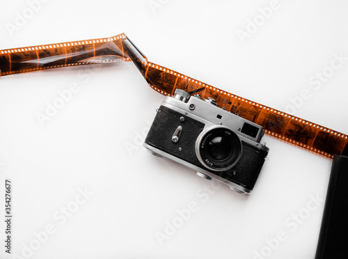 Vintage mock up /explore mockup with old vintage camera, space for text. Adventure template with retro elements, film roll, holiday hipster traveler mock-up. Working desk branding mock up top view.
